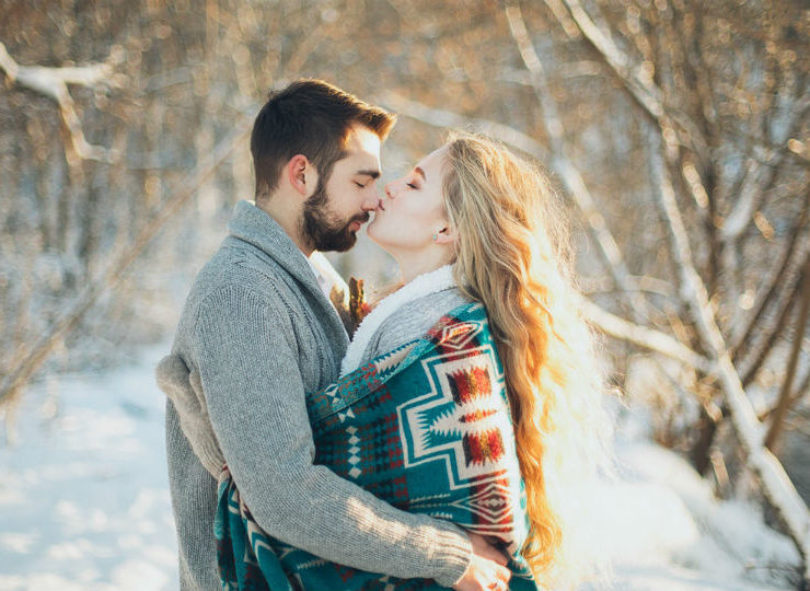 man-and-woman-hugging-each-other-about-to-kiss-during-snow-1927242
