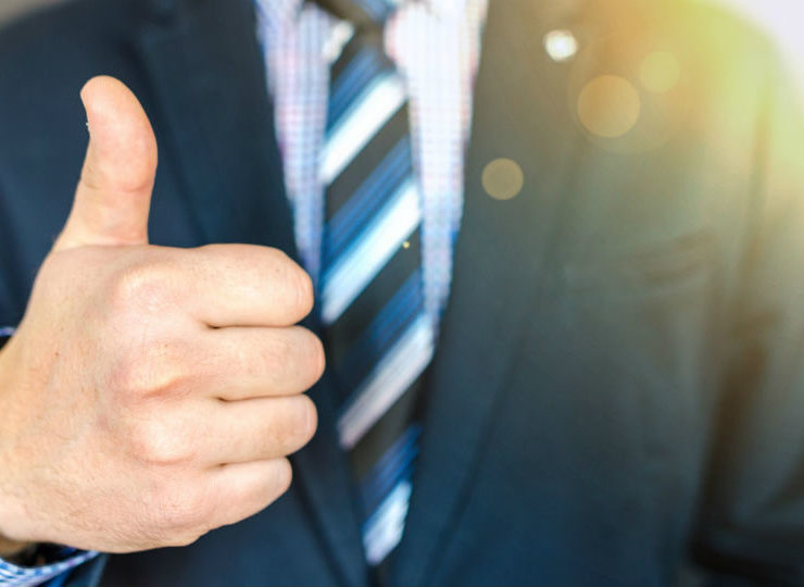 close-up-photo-of-man-wearing-black-suit-jacket-doing-thumbs-684385