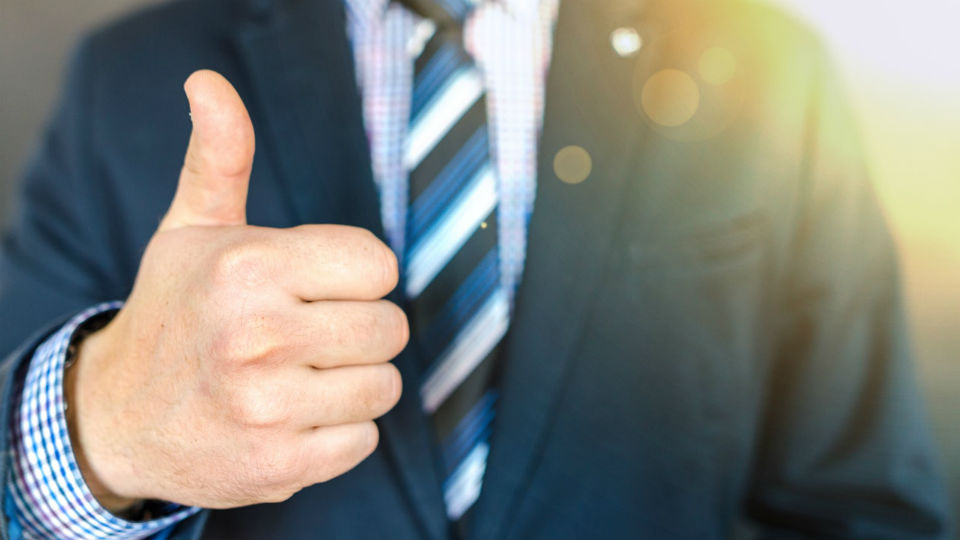 close-up-photo-of-man-wearing-black-suit-jacket-doing-thumbs-684385